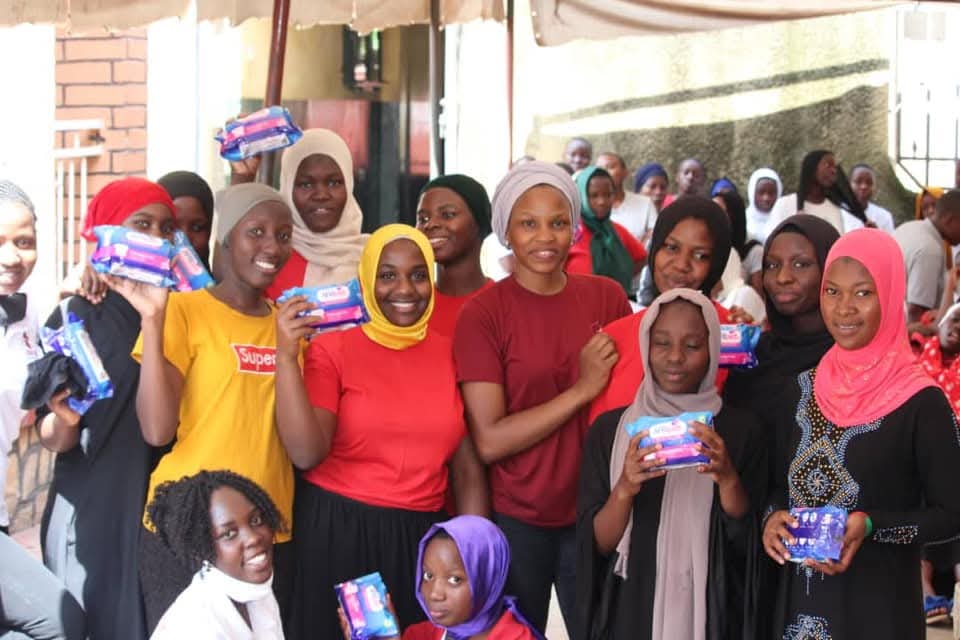 Sanitary pads being given out to young girls by ZAF team in kawempe division
